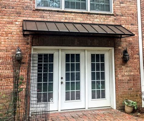 metal window awnings vs fabric